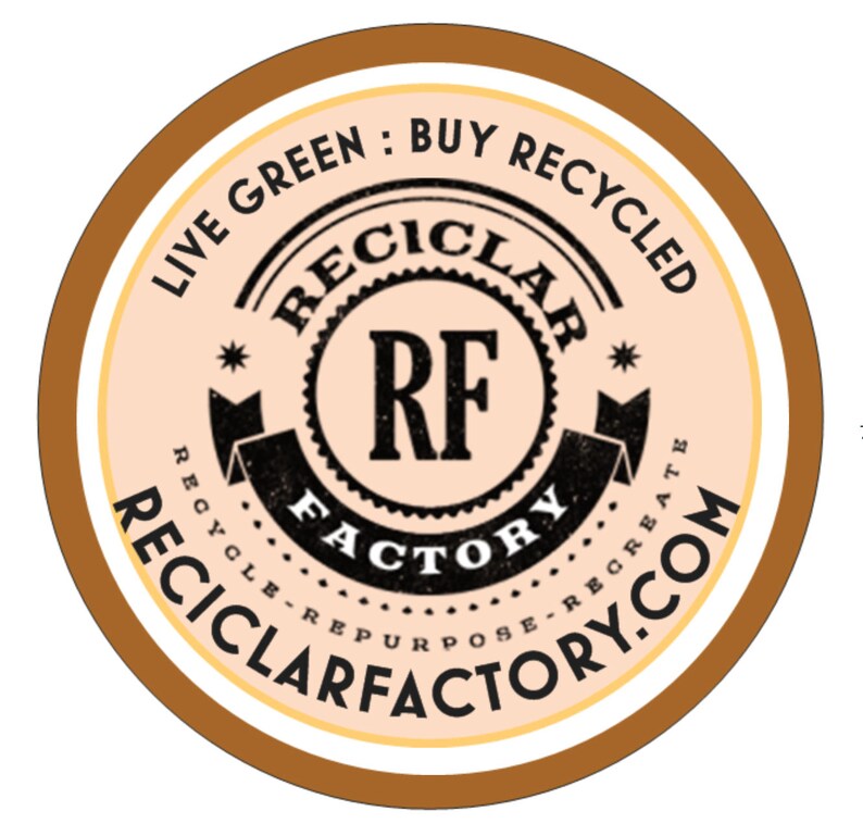 May include: A brown and white circular sticker with the text "Live Green: Buy Recycled" and "Reciclarfactory.com". The centre of the sticker features a black and white logo with the text "Reciclar RF Factory Recycle Repurpose Recreate"