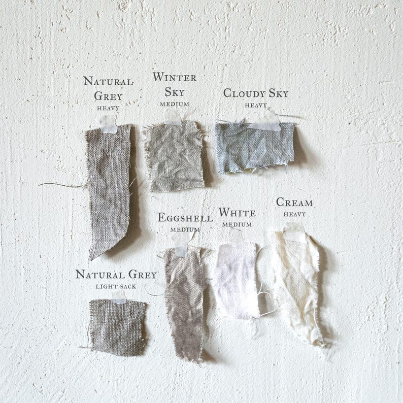 a white wall with a bunch of different types of paper on it