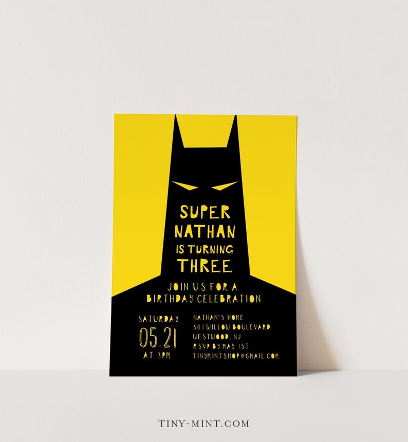 May include: A yellow and black birthday invitation featuring a silhouette of Batman. The text reads "Super Nathan is turning Three. Join us for a birthday celebration. Saturday 05.21 at 3PM. Nathan's Home 501 Willow Boulevard Westwood, NJ. RSVP by May 1st. tinymint shop@gmail.com. Tiny-Mint.com"
