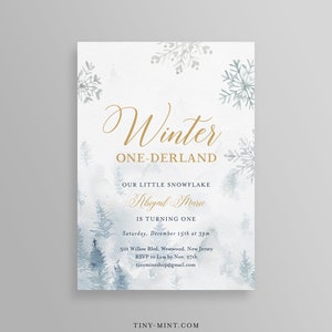 May include: Winter-themed invitation with gold script text reading "Winter ONE-DERLAND." The invitation includes the text "Our Little Snowflake Abigail Marie is turning one." The design features watercolor snowflakes and pine trees in shades of blue and grey.