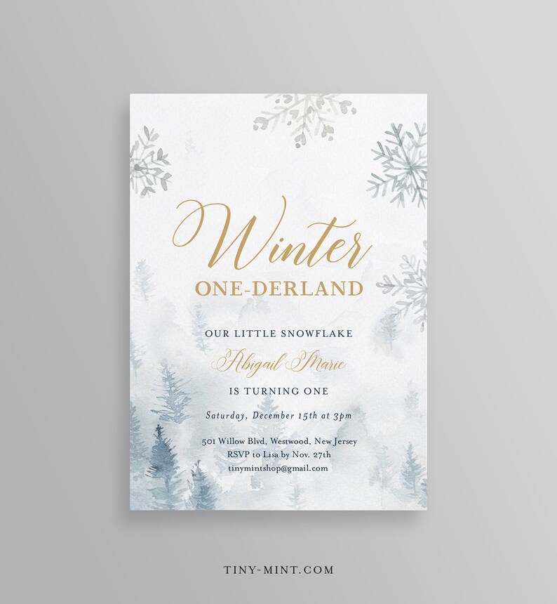May include: Winter-themed invitation with gold script text reading "Winter ONE-DERLAND." The invitation includes the text "Our Little Snowflake Abigail Marie is turning one." The design features watercolor snowflakes and pine trees in shades of blue and grey.