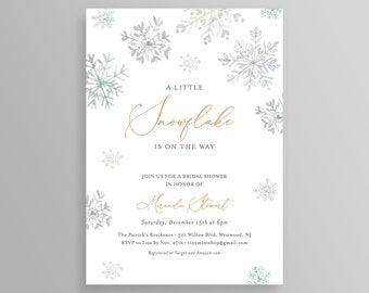 May include: A white invitation card with snowflake illustrations and gold script text. The text reads "A Little Snowflake is on the Way" and invites guests to a bridal shower for Miranda Stewart.