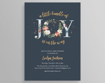 May include: Dark blue baby shower invitation with gold lettering and a floral wreath. The text reads "a little bundle of JOY is on the way". Details for Evelyn Jackson's baby shower are also included.