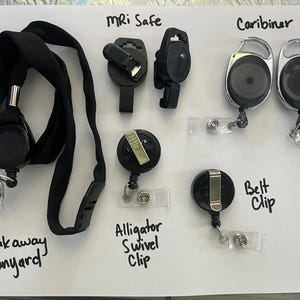 May include: A variety of retractable badge reels and lanyards, including a breakaway lanyard, an alligator swivel clip, a belt clip, a caribiner, and an MRI safe reel.