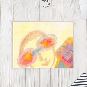 May include: A rectangular watercolor painting featuring a soft yellow background with two prominent oval shapes in shades of orange, pink, and blue, connected by a blue bridge, alongside a textured, multi-colored abstract form on the right side.