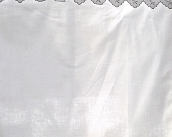 curtain with scalloped embroidery and pleats