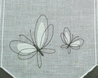 linen sheer curtain with its flowers and butterflies