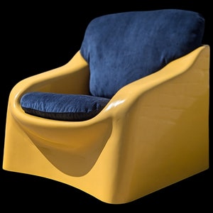 May include: A yellow armchair with a blue fabric cushion. The chair has a unique, curved design and a smooth, glossy finish.