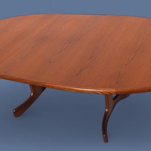 May include: A mid-century modern oval dining table. The table is made of wood with a warm brown finish. It has a smooth surface and curved legs. The table measures approximately 72 inches long.