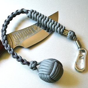 Monkey fist keychain, Braided paracord monkey fist key chain, brass bead, steel carabiner, grey