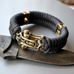 Black mens paracord bracelet with unique brass shackle/clasp,Stand with Ukraine, viking jewelry, gift for him, mens bangle, armband