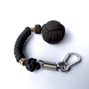 Monkey fist keychain, Braided paracord monkey fist key chain, brass bead, steel carabiner