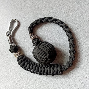 Monkey fist keychain, templar helmet bead, Braided paracord monkey fist key chain, brass bead, steel carabiner, green