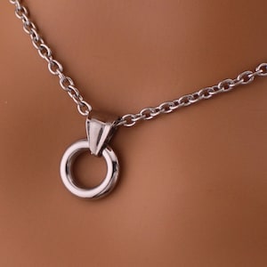 a close up of a necklace on a mannequin