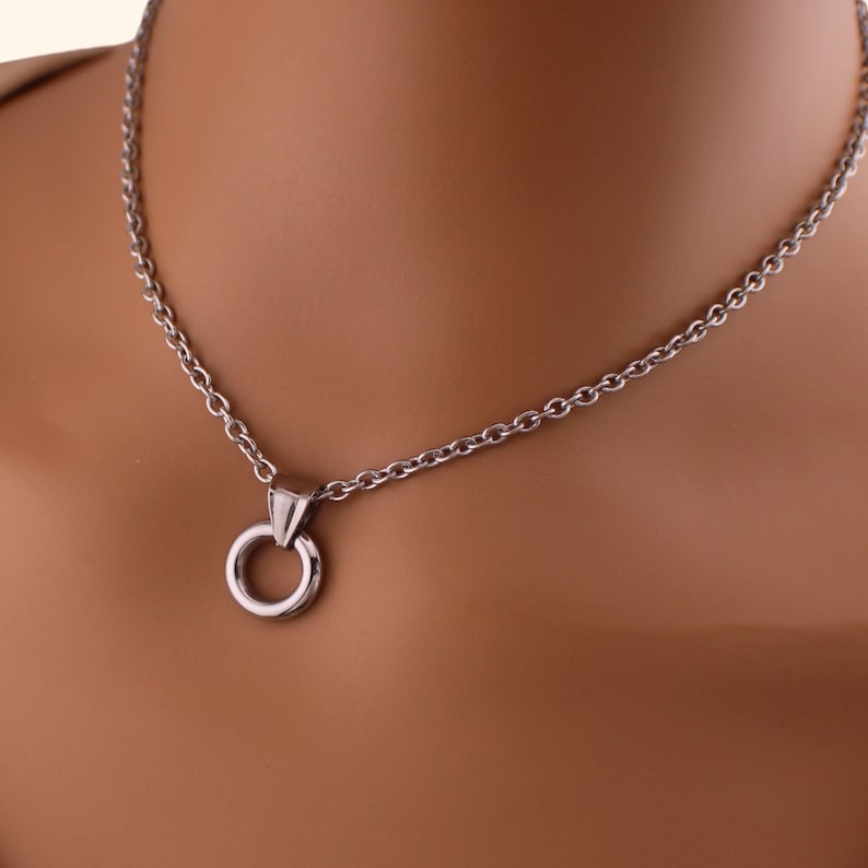 a close up of a necklace on a mannequin