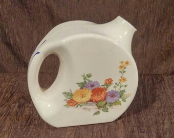 National Brotherhood Operative Potters water pitcher. Floral design