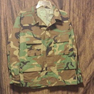 Military issue camouflage jacket, size large