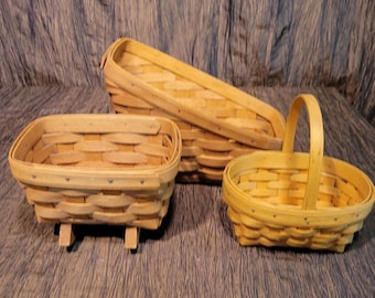 Set of  Longaberger baskets, oval with handle, rocking rectangle and tall back storage.