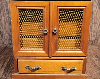 Vintage warm brown wood jewelry box with 4 drawers with music box