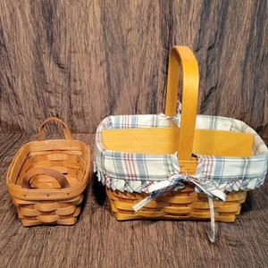 Set of 2 Longaberger rectangle baskets with handles, 11" x 8" x 5 1/2" and 7 1/4" x 5 1/4" x 3 1/2"