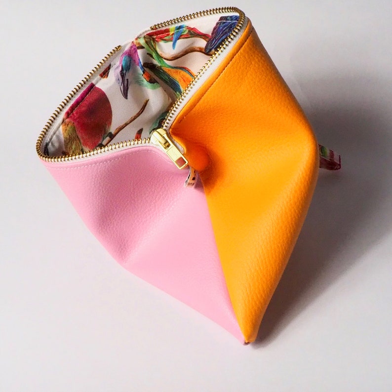 pink and orange clutch bag