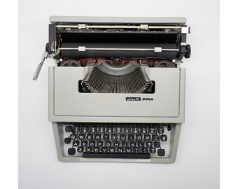 Macchina da scrivere funzionante - Macchina da scrivere Olivetti Dora e custodia