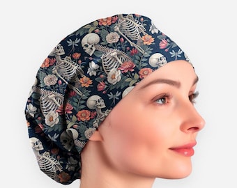 May include: A scrub cap featuring a dark navy blue background with a repeating pattern of human skulls, skeletal rib cages, and various colorful flowers including pink, orange, and white blossoms, interspersed with small blue dragonfly illustrations.