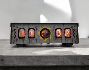 May include: A vintage-style clock with a distressed metal casing and four red glowing Nixie tubes displaying the time 11:32. The clock has a yellow gear with a red glowing center.