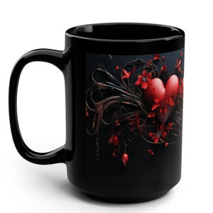 May include: Black coffee mug with a red heart surrounded by black and red floral designs.
