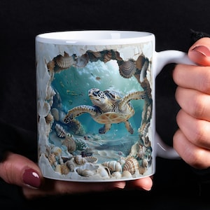 May include: White ceramic mug with a colorful image of a sea turtle swimming in a coral reef. The image is surrounded by a cracked, broken wall effect.