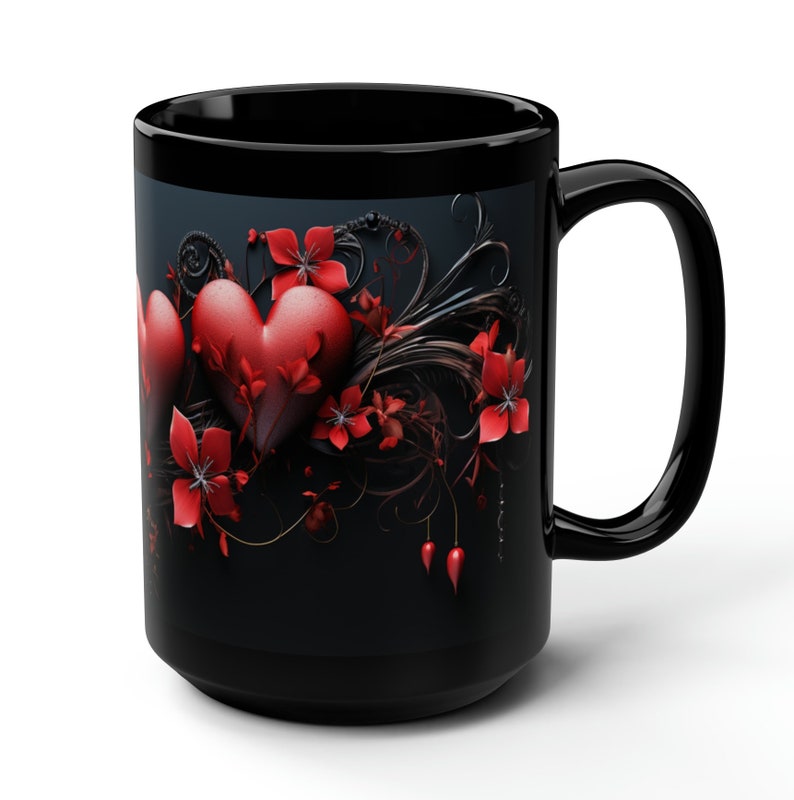 May include: Black coffee mug with a design of red hearts and flowers on a dark background.