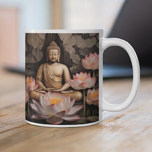May include: White ceramic mug with a design of a golden Buddha meditating in a lotus flower garden. The background is a dark brown with a water-like effect.