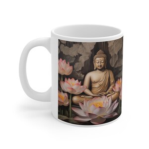 May include: White ceramic mug with a colorful image of a golden Buddha meditating in a lotus flower garden. The background is a dark brown with a pattern of leaves.