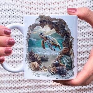 May include: White ceramic mug with a 3D design of a sea turtle swimming in a blue ocean with seashells and coral. The mug has a handle and is perfect for coffee or tea.