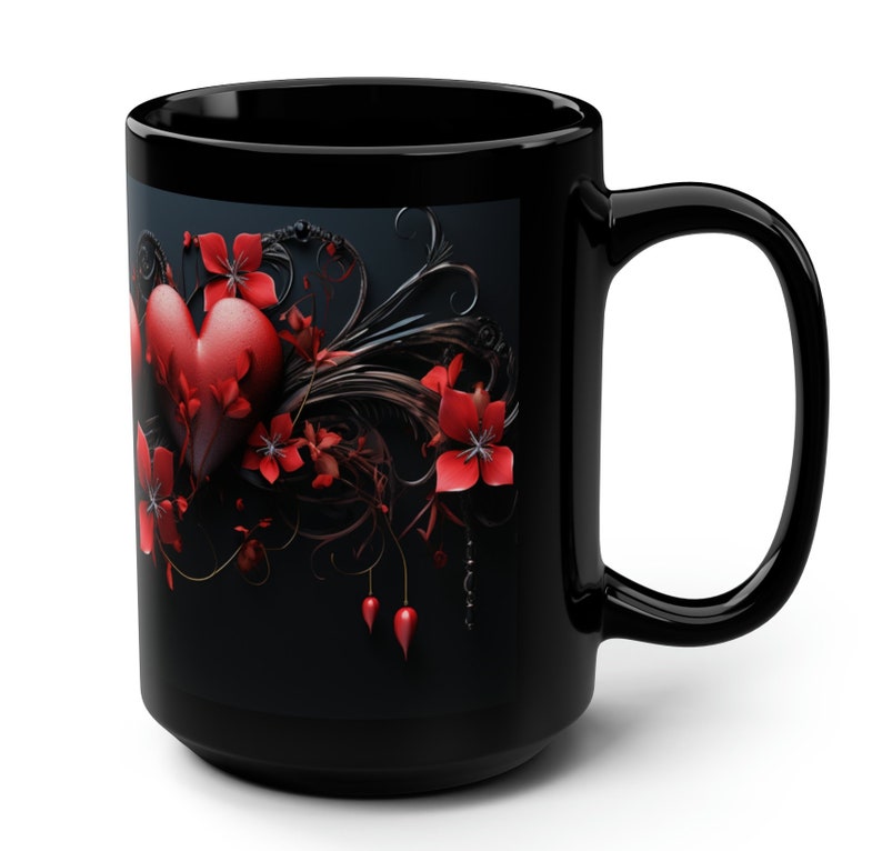 May include: Black coffee mug with a red heart and floral design. The heart is surrounded by red flowers and black vines.