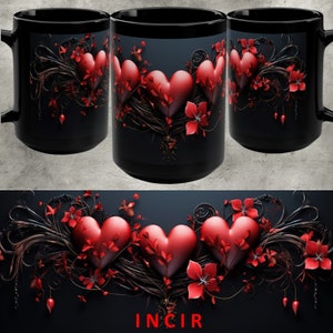 May include: Three red hearts with a black and red floral design on a black mug. The mug has the word "INCIR" printed on the bottom.