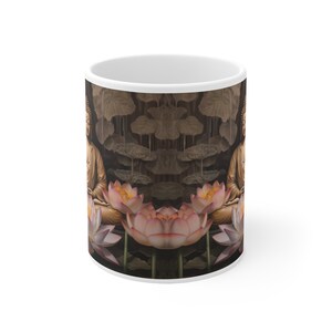 May include: White ceramic mug with a design of a golden Buddha sitting in a lotus flower surrounded by other lotus flowers. The background is a dark brown with a pattern of leaves.