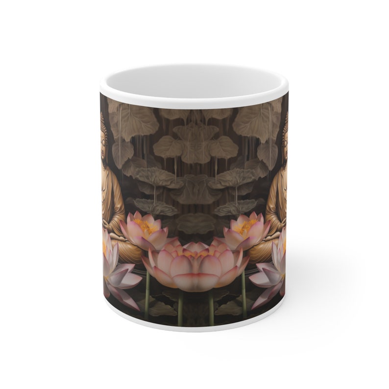 May include: White ceramic mug with a design of a golden Buddha sitting in a lotus flower surrounded by other lotus flowers. The background is a dark brown with a pattern of leaves.