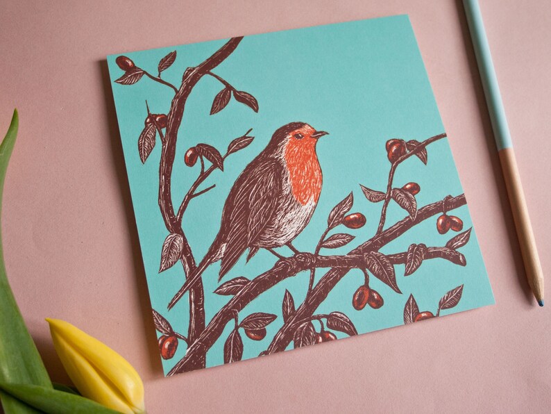 May include: A robin perched on a branch with red berries against a turquoise background. The robin is brown with a red breast and is depicted in a vintage style.