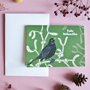 Cartolina di Natale Merlo, biglietto di auguri di Natale