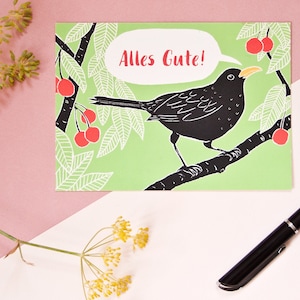 Carte postale Bonne chance, illustration animalière merle