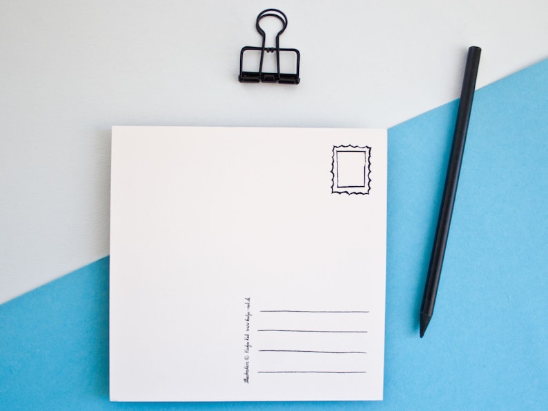 May include: A blank white postcard with a black stamp outline and lines for an address. A black pencil and a black binder clip are on a blue and white background.