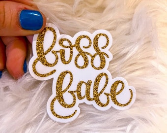 May include: White sticker with gold glitter lettering that reads "boss babe".
