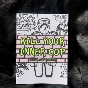 May include: A drawing game titled "Kill Your Inner Cop" with a black and white illustration of a police officer with a pink brick wall behind him. The text is in green and pink.