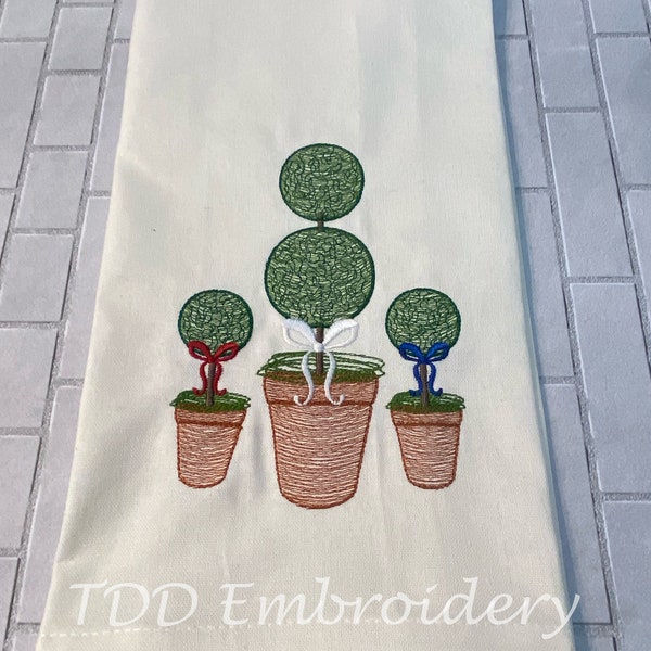 Trio de motifs de broderie topiaires