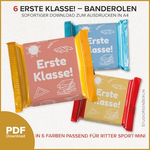 May include: Image of colorful candy bar wrappers with the text "Erste Klasse!" in white. The wrappers are in pink, blue, yellow, and red. The text "PDF Download" is also visible.