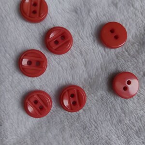 Button Ø10 mm Lot of 7 units. Round, pink orange color. For shirts and blouses. Various models and lotsotes