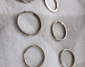 Batch of 7 metal rings of different size and shape.