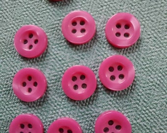Botón Ø10 mm.  Redondo. Especial para camisas y blusas. Color rosa con brillo. Doble borde. 4 agujeros. Lote.