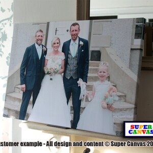 May include: A wedding photo of a couple with a bridesmaid and a flower girl. The bride is wearing a white dress and the groom is wearing a dark suit. The bridesmaid is wearing a light blue dress and the flower girl is wearing a white dress with a flower crown. The photo is printed on a canvas.